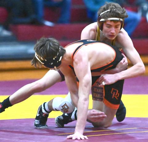 Tayten Kurkowski of Webster Area gets a grip on Camden Tebay of Dell Rapids Quarriers during their match at North/South Double Dual Feb. 5 in Webster. Kurkowski lost the match 1-4 by decision. Reporter &amp; Farmer | Brianna Jorgenson, Captured Creations Photography