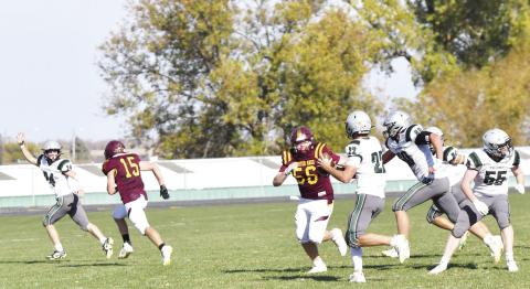 Webster Area Bearcat defensive lineman John Sonstebo (56) chases after Clark/Willow Lake quarterback Emmerson Larson (22) after he rolled left with a trio of blockers trailing him during the last home game of the season Oct. 19. Clark/Willow Lake reciever Griffin Musser (24) signals he’s open with Bearcat defender Gage Baumgarn (15) trailing behind him. The Bearcats ultimately closed out their season in a 6-18 loss against the Cyclones. Reporter &amp; Farmer | Brenner Cariveau