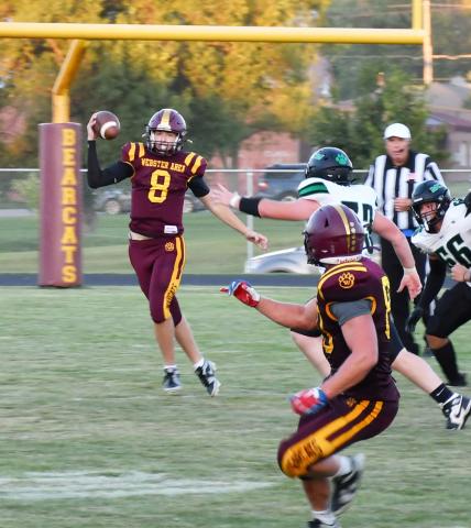 Webster Area quarterback Ian Lesnar attempts a pass on the run Aug. 30 against McCook Central/Montrose. Bearcats had little success on offense as the game finished with a score of 6-33, resulting in a Webster Area loss. Reporter &amp; Farmer | Brenner Cariveau