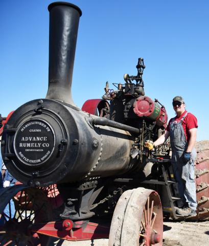 Throughout Sept. 6-8 a plethora of antique cars and agricultural equipment were displayed at the James Valley Threshing Show daily parades. On Sept. 7, Mike Mc-Garry from Parker, was working on his old tractor by cleaning out the check valve ensuring it was ready for the lap around the threshing show grounds. Reporter &amp; Farmer | Brenner Cariveau