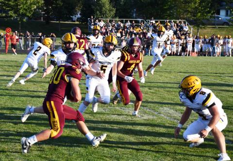 Webster Area running back Tate Mammenga braces for contact with a Groton Area Tiger during the homecoming contest Sept. 6, which resulted in a 7-14 loss for the Bearcats. Reporter &amp; Farmer | Brenner Cariveau