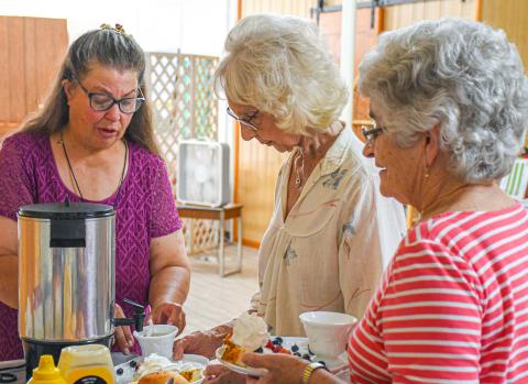 Treats and tea were part of the July 11 pollinator tea party at Day County Arts Center where more than a dozen people took part. The event featured master gardeners, angel food cake and, of course, tea. Pictured in the food lineup are Teresa Mikklesen, Nancy Bain and Mary Lindquist. Reporter &amp; Farmer | Amanda Dulitz
