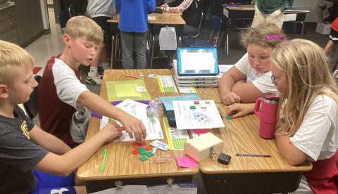 Fifth Grade students seen here Jaxson Hansen, Kru Johnson, Kinsley Ash, and Reagan Fish are working to crack the mathematical code for one of the six escape room challenges. Reporter &amp; Farmer | Subscriber Snapshot