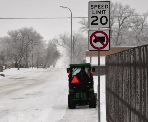 Monty Bloom removes snow with his garden tractor as he drives down W. 6th Ave. past the Main St. intersection clearing snow in his path on the sidewalks Dec. 2. Reporter &amp; Farmer | Brenner Cariveau