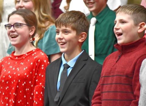Webster Area seventh graders, from left, Cheyenne Powell, Ian Mammenga and Bryson Bloom perform in the school’s winter concert Dec. 6 at Webster Armory. The event featured choral and band performances from middle and high school students. Reporter &amp; Farmer | Leyton Beardslee