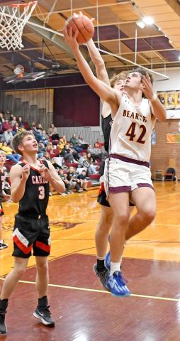 Webster Area Bearcat Jack Shoemaker goes up for a basket in a home game Jan. 9 against the Deuel Cardinals. The Cats fell 64-38. Reporter &amp; Farmer | Robert Dulitz