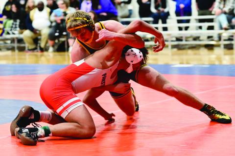 Webster Area boys wrestlers competed at the Little B Tournament in Parkston Jan. 25. Here, Bearcat wrestler Gage Baumgarn attempts to grapple Parkston’s John Weber in the quarterfinal match of the 165 pound weight class. Reporter &amp; Farmer | Dax Jorgenson