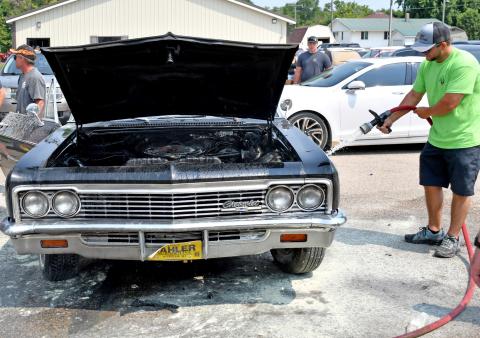 Classic car catches fire after parade