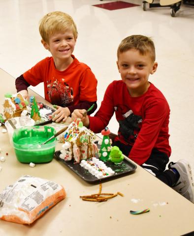 Missy Hortness’ first grade class spent time making gingerbread houses Dec. 12. Here from left, Camdyn Huffman and Lawson VanderLinden sit next to their gingerbread houses. Reporter &amp; Farmer | Brenner Cariveau