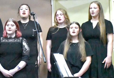 From back row left, Izzy Ladue, Rylan Huggett, Callie Shoemaker; from front row left, Shantel Holzerland and Tenley Spiering join other students in singing during the Webster Area music concert May 4. Reporter &amp; Farmer | Connor Handrahan