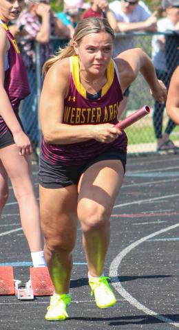 Gracie Cadwell bursts forward at the start of a relay race during the Webster Invitational track meet May 16 held in Webster. Reporter &amp; Farmer | Subscriber snapshot