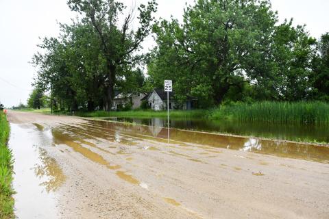 Heavy and consistent rain in the area has made many area gravel roads look like the one shown above, June 25 in Waubay near the crossing of Main Street and Jones Avenue shows rising water in the ditch flowing onto the road. Reporter &amp; Farmer | Annie Witt