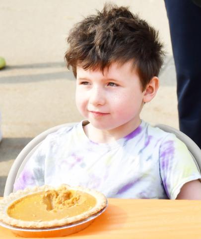 During the Oct. 5 celebration of Pumpkin Fest a pumpkin pie eating contest was held in front of Blossom Shoppe &amp; Gifts. Here, 6-year-old Japhet Althoff from Watertown takes a break from eating his pumpkin pie during the contest. Reporter &amp; Farmer | Brenner Cariveau