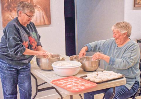 Lori Keller, left, and Sue Walter, right, help make lefse at Tabor Church, Webster lefse fundraiser Nov. 21. Keller and Walter were in charge of mixing together flour, sugar, potatoes and cream to get delicious tasting lefse. Reporter &amp; Farmer | Connor Handrahan