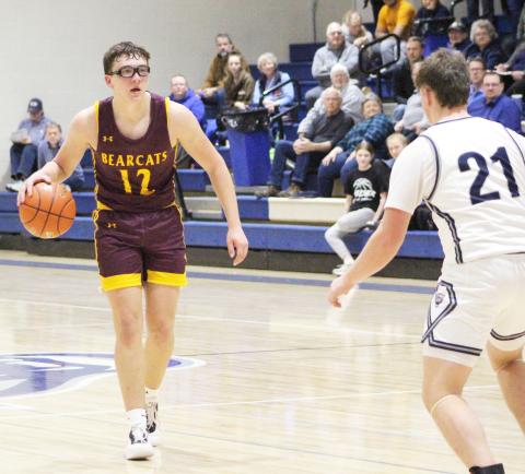 Webster Area Bearcats faced off against Great Plains Lutheran Panthers in an away game Feb. 4 which resulted in a 45-59 Bearcats loss. Here, Jeron McCreary (12) approaches the top of the key while Panthers defender Austin Rubendall (21) prepares to get into position. Reporter &amp; Farmer | Subscriber Snapshot