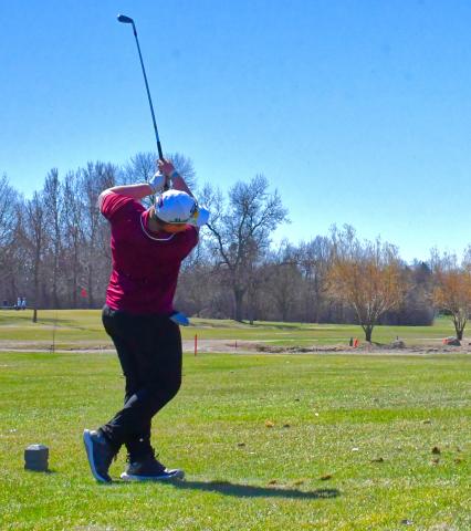 Zayden Finch of Wesbter Area tees off on a par three, having a nice shot and landing on the outside of the green during the Webster Area Invitational April 21. Reporter &amp; Farmer | Connor Handrahan