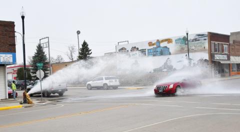 The fire hydrant on the corner of Main St. and W. 6th Ave., Webster was being flushed Nov. 6 while a car passes through the gushing water. Reporter &amp; Farmer | Brenner Cariveau