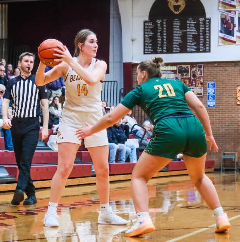 Mallory Steiner (14) of Webster Area looks to pass during the Bearcat’s girls varsity basketball game against Aberdeen Roncalli Dec. 29 in Webster. Bearcats couldn’t keep up with the Cavaliers and fell 36-50. Reporter &amp; Farmer | Leyton Beardslee