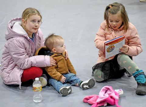 There was something for everyone at the Day County Farm &amp; Home Show in Webster Jan. 25. Here, Leah Waldner, eight; Jadon Weaver, 14 months and Laura Waldner, four read books in front of the Webster Public Library booth. The Waldner sisters are the daughters of Darin and Melissa Waldner and Weaver is the son of Gary and Janna Weaver. Reporter &amp; Farmer | Amanda Dulitz