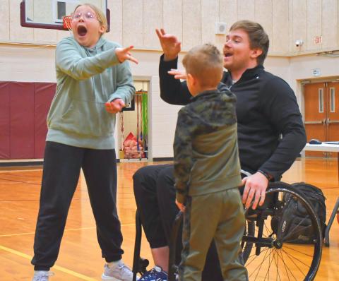 From left, Kenzie Nelson and Lincoln Vander Linden face off in the final round of a rock, paper, scissors tournament during Hunter Pinke’s presentation. Pinke told his story about how he achieved his goals and told students how they can achieve their own dreams. Reporter &amp; Farmer | Connor Handrahan