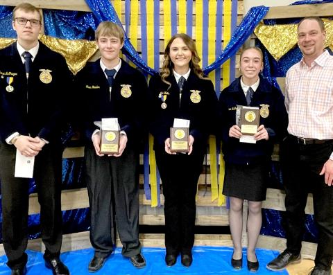 Best record book awards, sponsored by Dacotah Bank, were presented at the Webster/ Waubay FFA banquet by bank president Kelly Hanson, right. Award recipients for each grade, from left, are senior Blaise McGregor, junior Tevin Howder, sophomore Lola Wells and freshman Macee McGregor. Reporter &amp; Farmer | Subscriber snapshot
