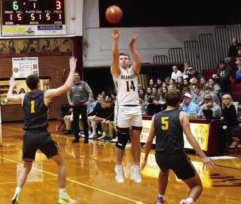 Webster Area Bearcats hosted Groton Area Tigers Dec. 30 in a contest the Bearcats lost 46-76. Here, Matthew Mount (14) attempts a three over Groton Area defenders Keegen Tracy (1) and Becker Busma (5). Reporter &amp; Farmer | Brenner Cariveau