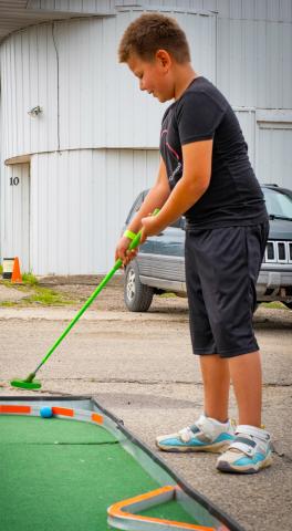 Braxton Renville, age six, son of Spirit Renville of Waubay plays mini golf during Waubay Fun Fest July 19. The annual festival had a feelin’ the vibe theme and took place July 18-20. Reporter & Farmer | Leyton Beardslee