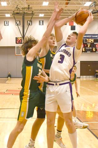 Mustangs boys faced Northwestern Wildcats March 7 in the first round match of the regional bracket. Waubay-Summit won the contest with a 51-43 score. Here, Hogan Hlavacek (3) attempts to shoot the ball amid a cluster of Northwestern defenders. Reporter &amp; Farmer | Brenner Cariveau