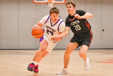 McKoy Pereboom (24) of Waubay/Summit drives the ball up court during the Mustangs narrow 45-46 loss to Sisseton Redmen Jan. 13 in Summit. Pereboom finished with three points and the Mustangs fall to a record of 3-4 on the season. Reporter &amp; Farmer | Leyton Beardslee