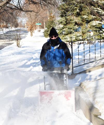Day County received the first snow fall of winter late Nov. 19 with blistering winds and gusts of snow. Here, Sam Janssen uses a snow blower to clear his sidewalk of the fresh snow on E. 9th Ave., Webster Nov. 21. Reporter &amp; Farmer | Brenner Cariveau