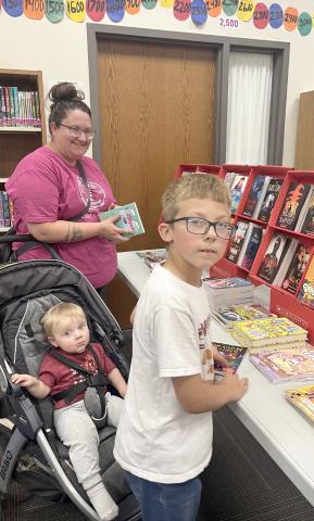 Webster Area School held a bookfair Oct. 7-10 along with parent/teacher conferences. The event helps raise money for the school’s libraries. Rachel Rolstad with Charlie Rolstad and Brayden Town enjoy looking through the selections. Reporter &amp; Farmer | Subscriber snapshot