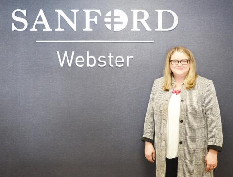 Melissa Cunningham was hired as the new CEO for Sanford Health and Bethesda Home in Webster Nov. 4. Here, Cunningham stands next to the Sanford sign in the clinic. Reporter &amp; Farmer | Brenner Cariveau