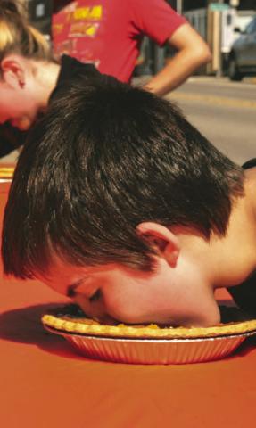 Lucas Breaw of Webster takes part in a pie eating contest during Pumpkin Fest in Webster Oct. 4. After five minutes of pie eating Breaw finished in second place. Reporter &amp; Farmer | Leyton Beardslee