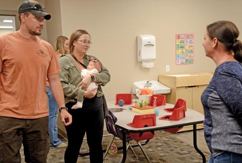 Jacob and Katlyn Lorton of Webster, along with seven-week-old daughter Maggie, listen to Knapp & Play child care expert Katy Sattler explain about the infant room practices and procedures during the center’s community open house event Sept. 3. The first-time parents were planning to bring their child to the center and were there to check out the newly renovated space. Staff were prepared to begin taking in children by Sept. 8, as of press deadline. The Knapp & Play Learning Center will have the capacity for