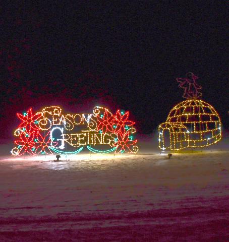 The annual display of holiday lights along Hwy. 12 and the Webster Golf Course are on display. Here, an igloo accompanies the season greetings sign Dec. 11. Reporter &amp; Farmer | Brenner Cariveau