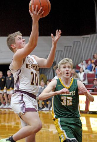 Webster Area Bearcat Michael Dorsett goes up for a basket Feb. 11 at home against Northwestern Wildcat Dallas Stoltenberg. The Wildcats came out the bigger cats on the game, going 66-55. On the night, Dorsett put up two points. Reporter &amp; Farmer | Subscriber snapshot
