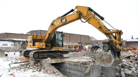 An excavator hauls rubble as the demolition of Webster Area’s 1950s wing progressed Dec. 11. Superintendent Jim Block estimated the demolition and rubble sorting would be completed within two to three weeks. Significant completion of the project which includes leveling the space to become a parking lot and installation of two new vestibule doors is set for July. Reporter &amp; Farmer | Leyton Beardslee