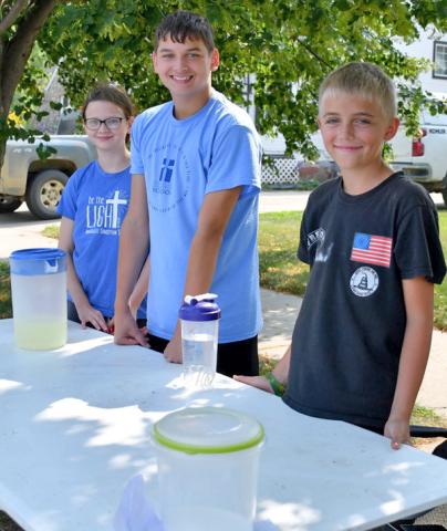 Helping members of the community beat the heat on Main Street of Webster July 25 were Mila and Colby Hoffman and Oakley Ascher. The trio spent the afternoon making and selling lemonade for some end of summer spending cash. Reporter &amp; Farmer | Annie Witt