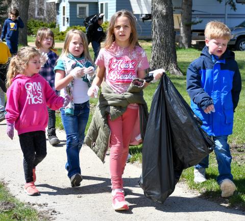Members of Webster Area Elementary kindergarten class worked their way around town last week to clean up any debris they happened to find. The April 22 activities focused on Earth Day. Pictured from left are, Elyzabeth Gangle, Althea Cyrus (back), Harlow Heupel, Rylee Wik and Caleb Sonstebo. Reporter &amp; Farmer | Amanda Dulitz