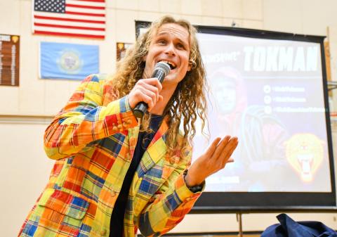 Motivational speaker Nick “Sunshine” Tokman sings during an assembly for Webster Area Middle and High School students Jan. 13 in the Webster Area High School gym. Tokman used his life experience as a professional fisherman on the Deadliest Catch TV show to discuss topics such as depression, low self-worth, discovering a career path and believing in yourself. Reporter &amp; Farmer | Leyton Beardslee