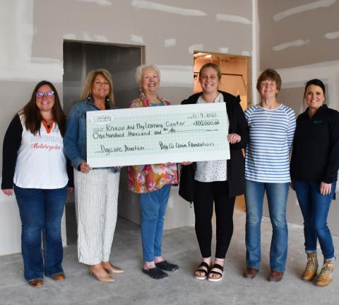 Day County Community Foundation members Amanda Dohn, Kim Sinner and Rita Johnson last week presented a $100,000 check donation to the Knapp &amp; Play Learning Center group, represented here by Jenna Wik, Kathy Meland and Rainy Hanson. Reporter &amp; Farmer | Annie Witt