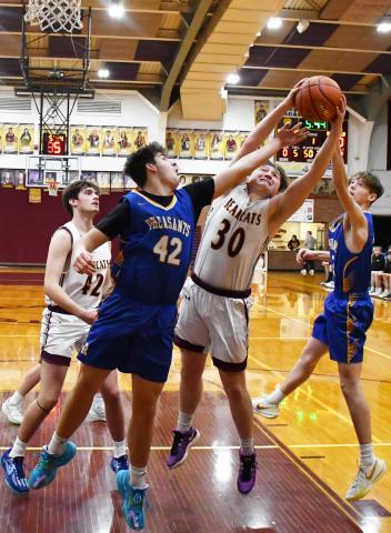 Webster Area Bearcats had their last home game of the season against Redfield and secured an 71-41 victory Feb. 22. Here, Thomas Kuecker (30) attempts to grab the rebound between Redfield’s Ethan Falk (42) and Isaac Banister (22) while Jack Shoemaker (42) rushes towards the paint. Reporter &amp; Farmer | Brenner Cariveau