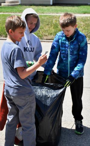 In honor of Earth Day, Webster Area Elementary students hit the streets of Webster to clean up any trash they found. Here third graders Odin Brockhaus, Hunter Ruff and Beckett Matthews assist in the endeavor April 23. Reporter &amp; Farmer | Leyton Beardslee