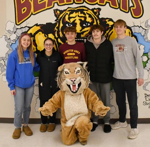 Webster Area wrestling program is sending five wrestlers to compete in the state tournament Feb. 27-March 1 in Rapid City. Here from left, Brooke Grajczyk, Jocelyn Rumpca, Tayten Kurkowski, Haeden Jorgenson and Gage Baumgarn stand behind the Bearcats’ mascot. Reporter &amp; Farmer | Brenner Cariveau