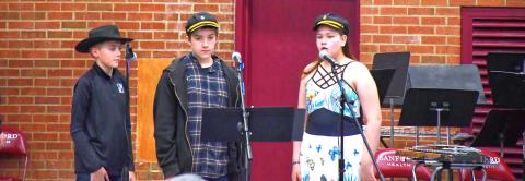 Webster Area Elementary put on their spring music concert April 20. The theme was based around western ideas and kids dressed up looking ready for the ranch life. From left, Oakley Ascher, Lucas Breaw and Piper Sichmeller introduce the next song. Reporter &amp; Farmer | Connor Handrahan