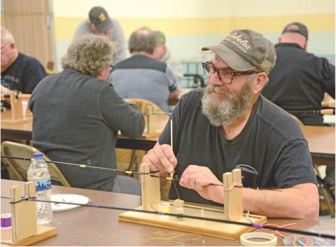 Veterans spend day building fishing poles