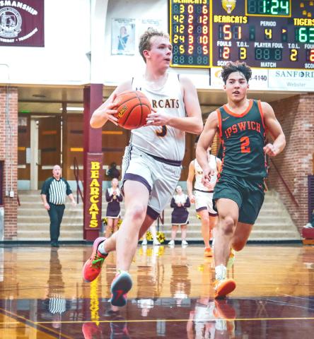 Sheldon Schmieg (5) of Webster Area looks to score a break-away layup during the Bearcats 62-65 loss to Ipswich Tigers Dec. 20 in Webster. Schmieg aided the Bearcats effort making two of his three attempts from beyond the arc. Reporter &amp; Farmer | Leyton Beardslee