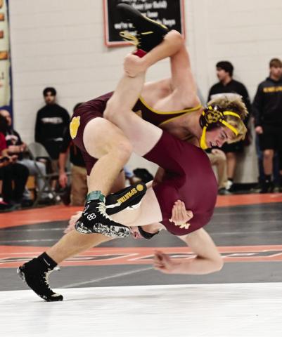 Webster Area wrestlers competed at the Ken Ruml Invitational Dec. 14 in Howard. Here, Webster Area wrestler Gage Baumgarn slams his opponent down to the mat. Reporter &amp; Farmer | Dax Jorgenson