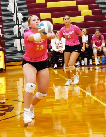Webster Area Bearcats hosted Tiospa Zina Wamdbi at the armory Oct. 8. The Bearcats won the match in three sets. Here, Katie Braun (13) tracks down the ball and hits it towards her teammates while Allison Case (6) prepares to make a play. Reporter &amp; Farmer | Brenner Cariveau