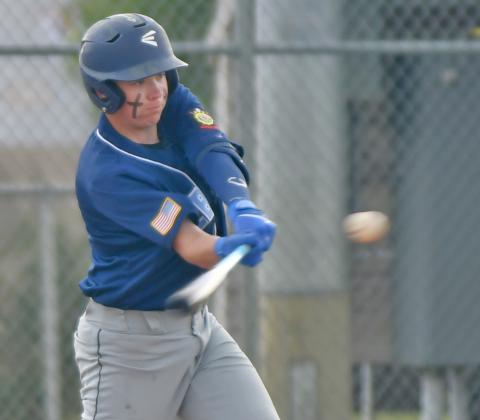 Webster’s Legion Post 40 batter Sheldon Schmieg takes a swing at the ball pitched to him by Winner/Colome June 15. Ultimately Post 40 fell 2-9 on the night. Reporter &amp; Farmer | Amanda Dulitz